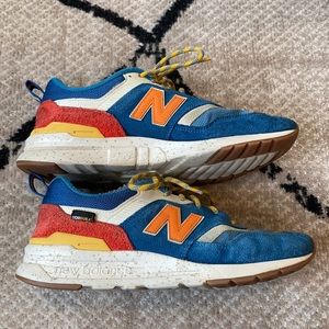 New Balance 997 in a blue and red color